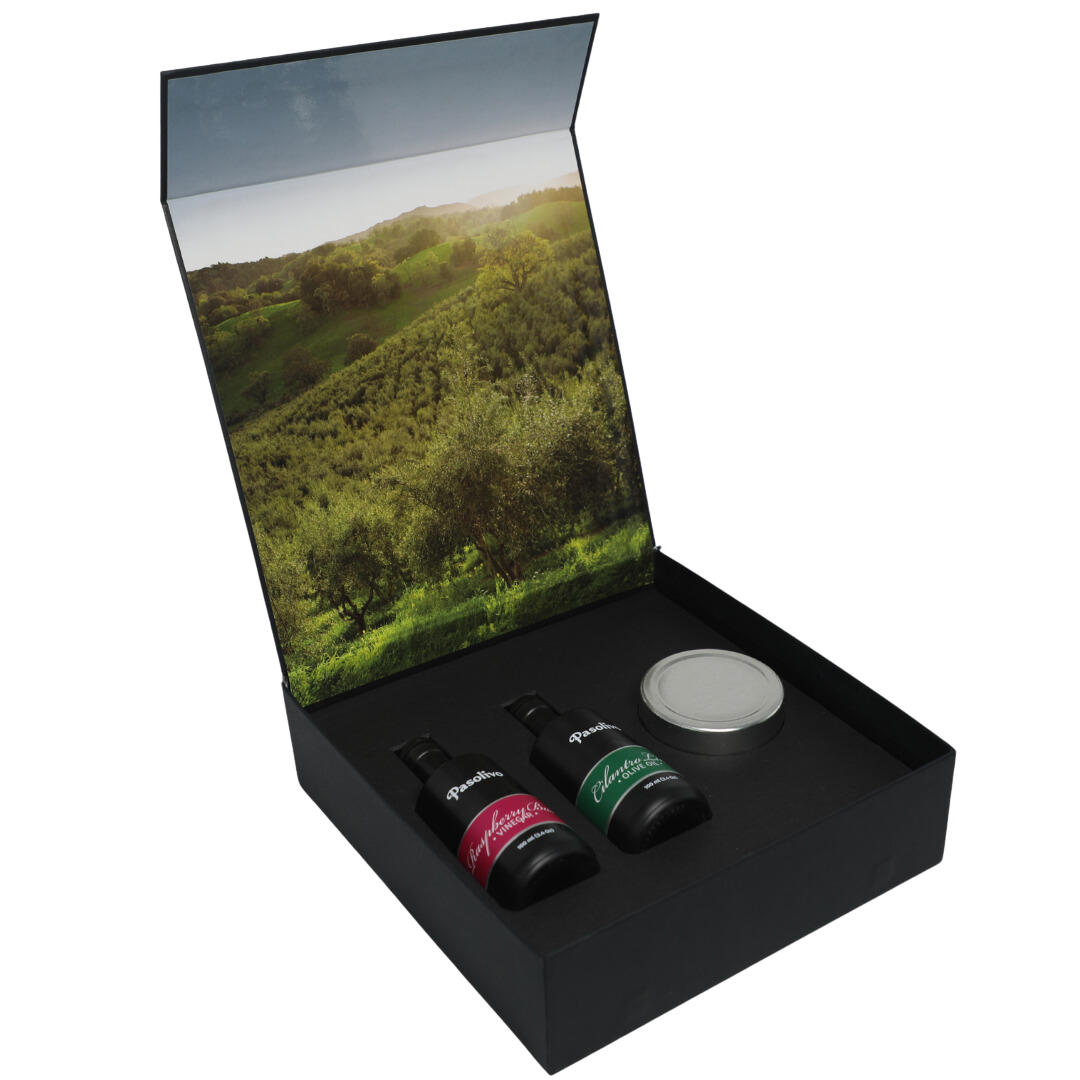 Premium Pasolivo products packaged in beautiful black box with green olive orchard imagery.