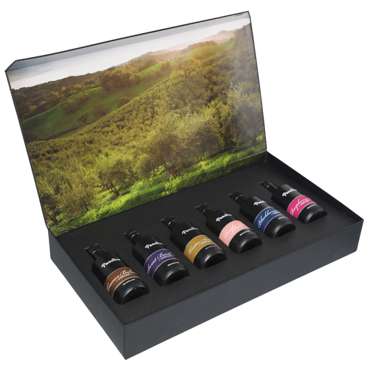 Premium Pasolivo products packaged in beautiful black box with green olive orchard imagery.