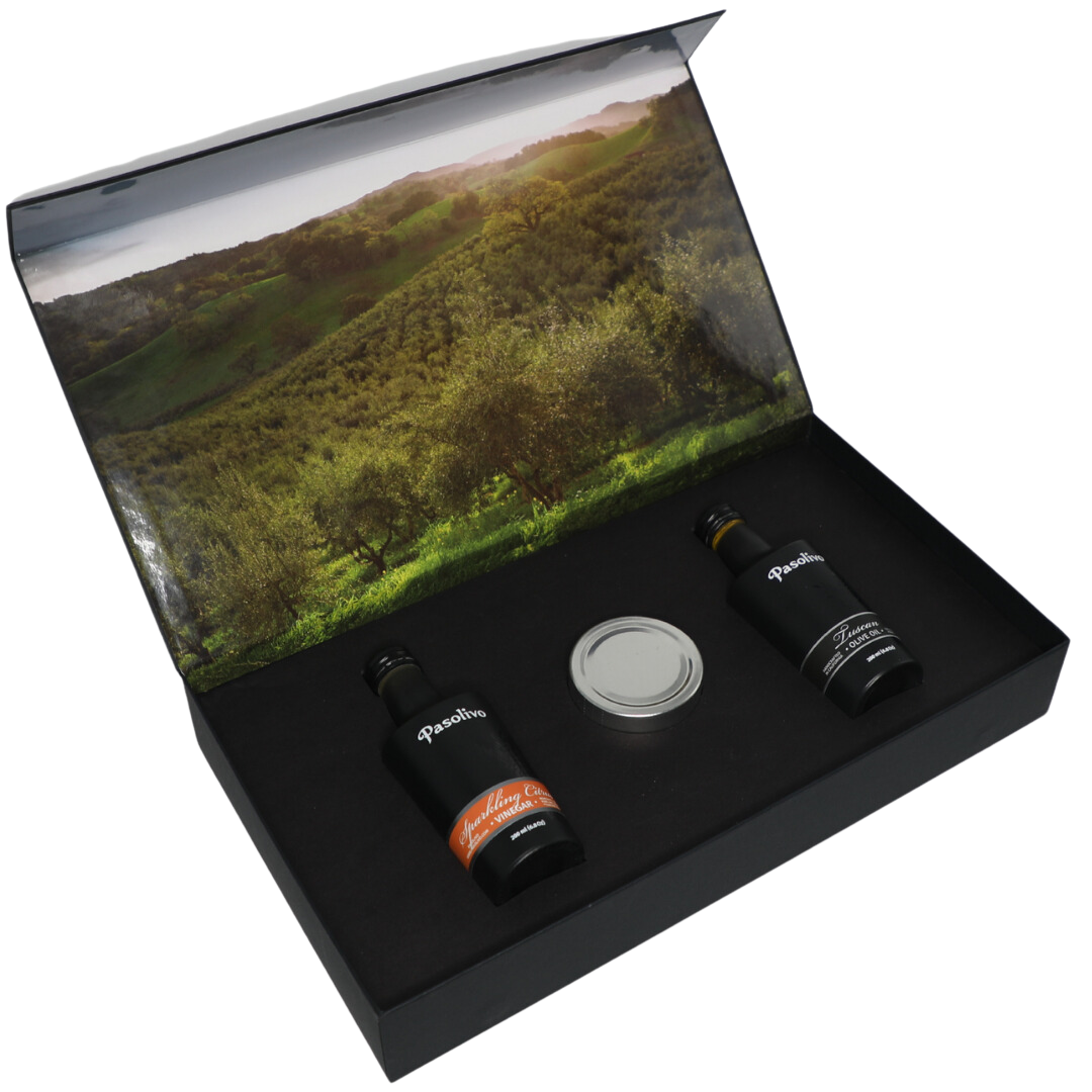 Premium Pasolivo products packaged in beautiful black box with green olive orchard imagery.